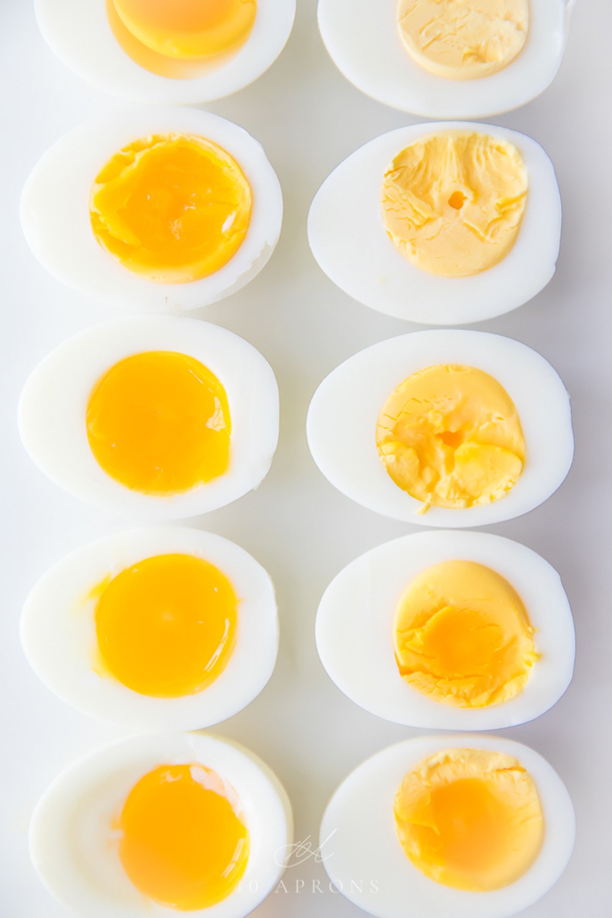 Hard and soft boiled eggs cut in half.