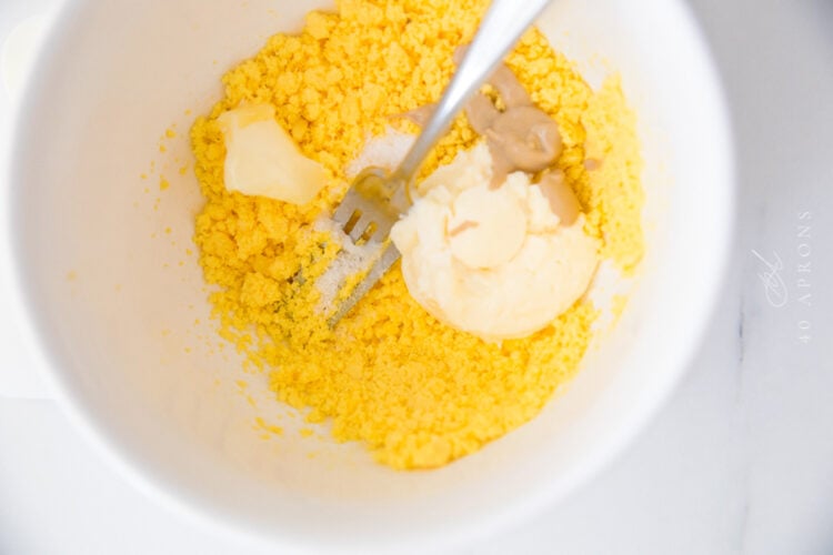 Egg yolk filling ingredients in large mixing bowl before being combined.