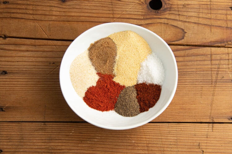 Dry rub spices in a small white bowl.