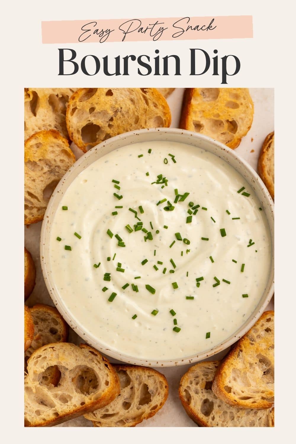 Close up of a bowl of Boursin dip surrounded by crostini. There is a frame on the image with Pinterest-optimized text.