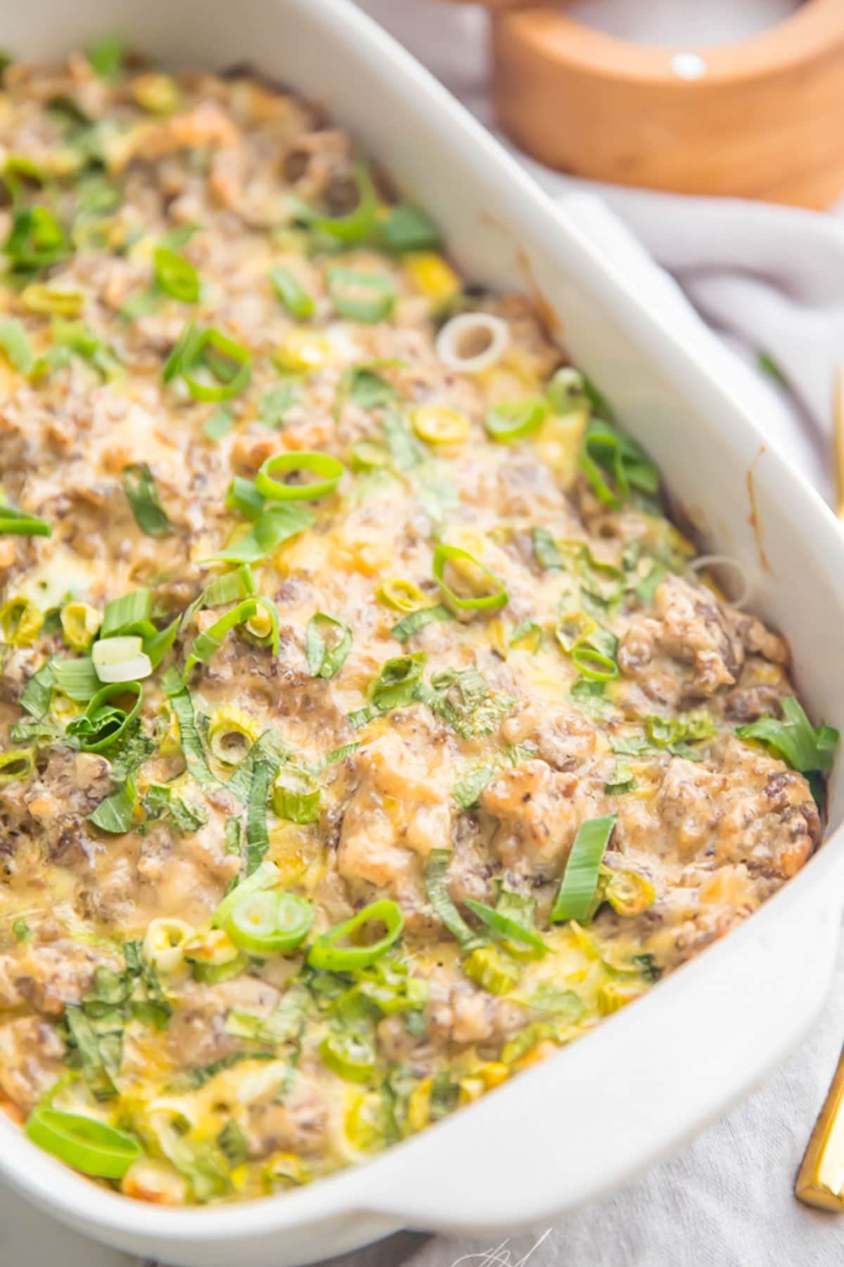 Whole30 sausage, egg, and hashbrown breakfast casserole in a casserole dish.