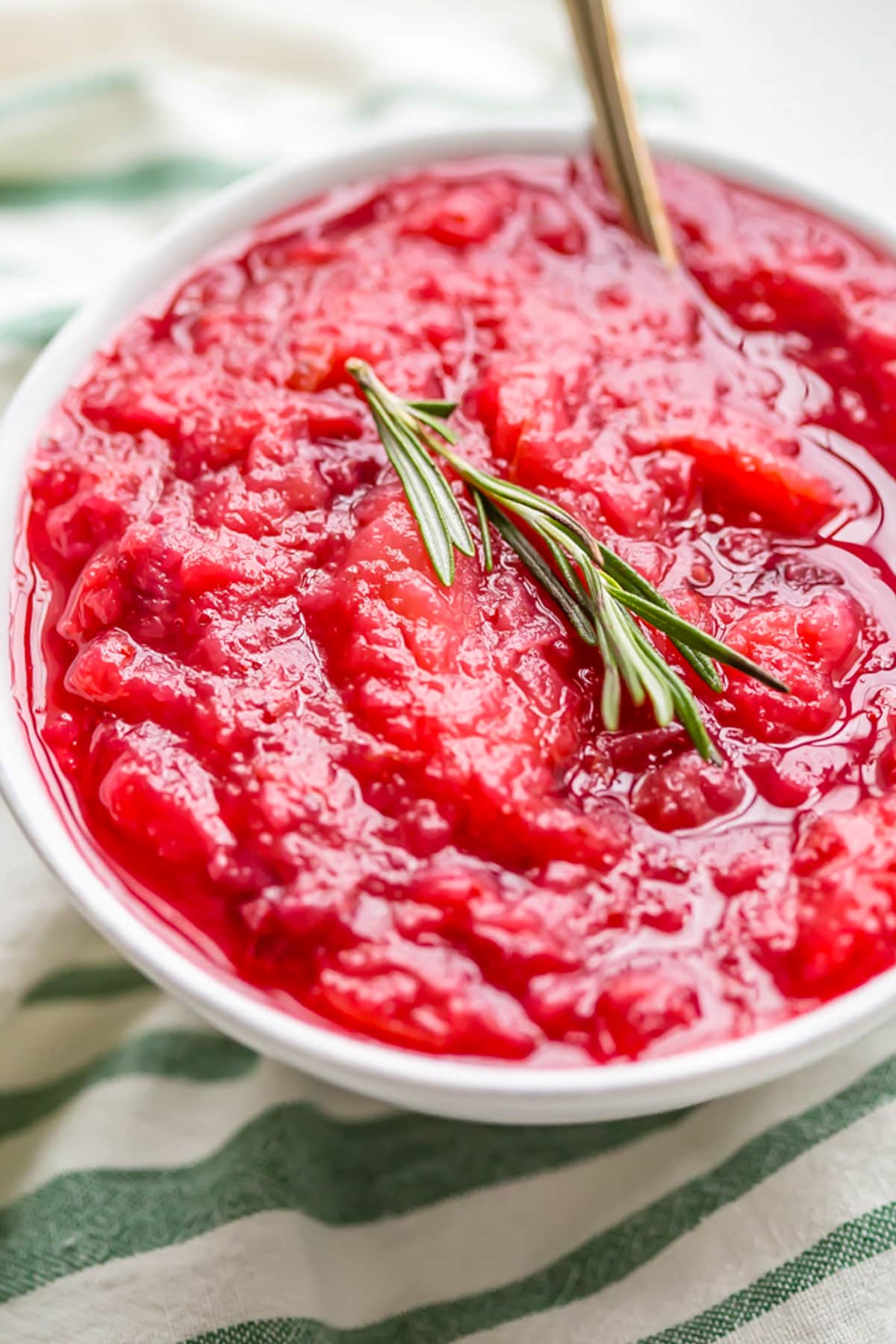 A bowl of bright red Whole30-compatible cranberry sauce made in the Instant Pot.