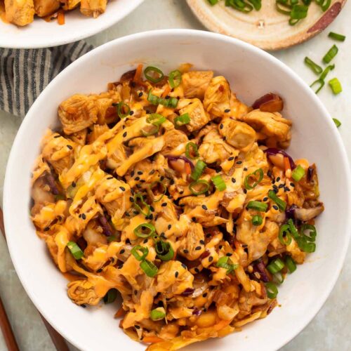 Two bowls of chicken egg roll in a bowl on a table.