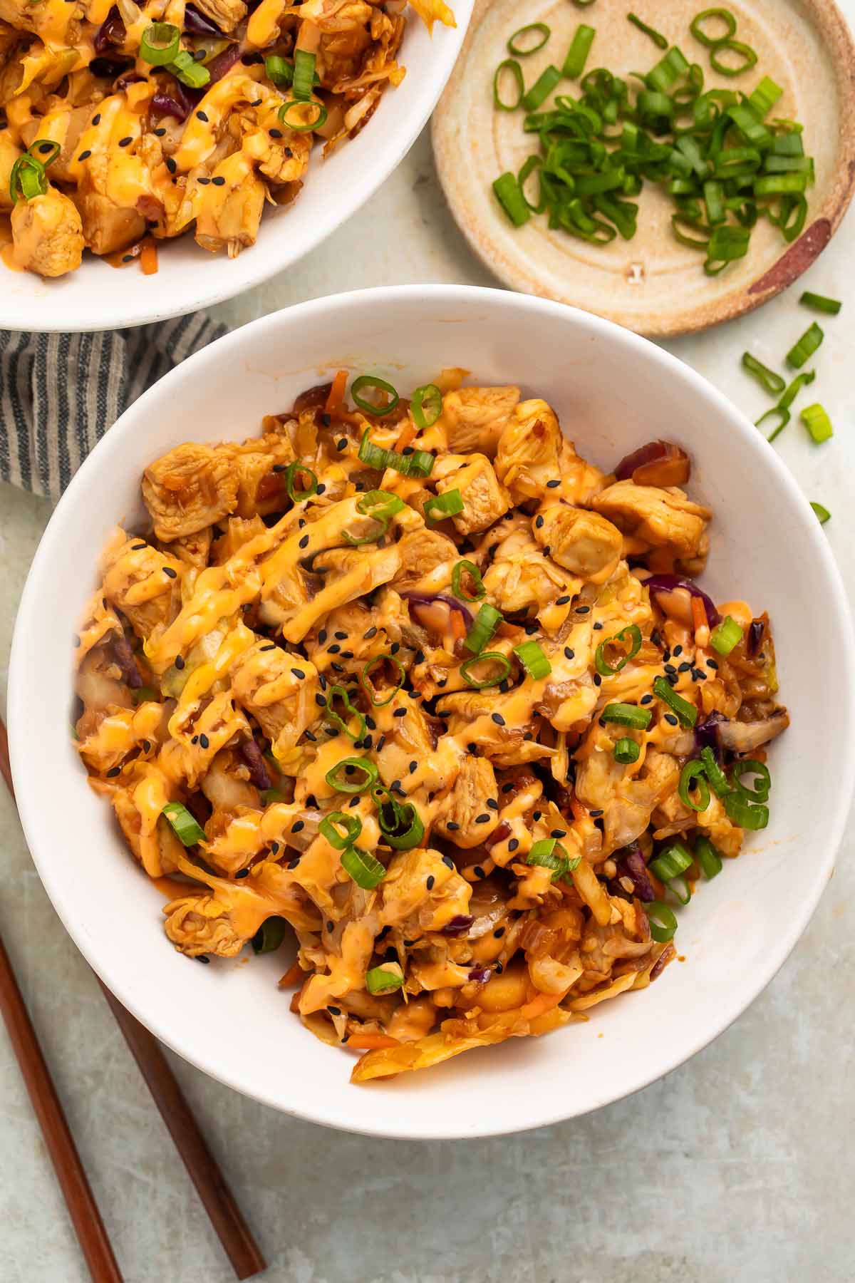 Two bowls of chicken egg roll in a bowl on a table.