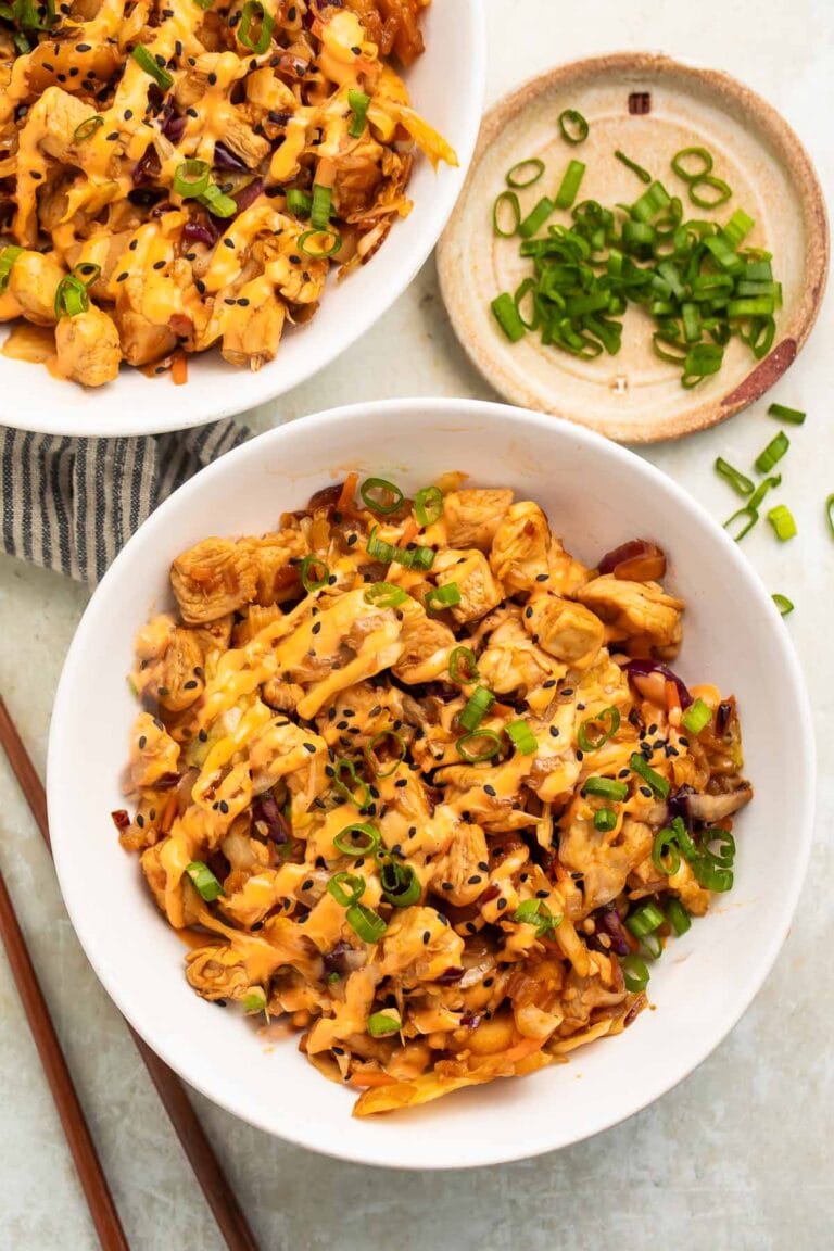 Two bowls of chicken egg roll in a bowl on a table.