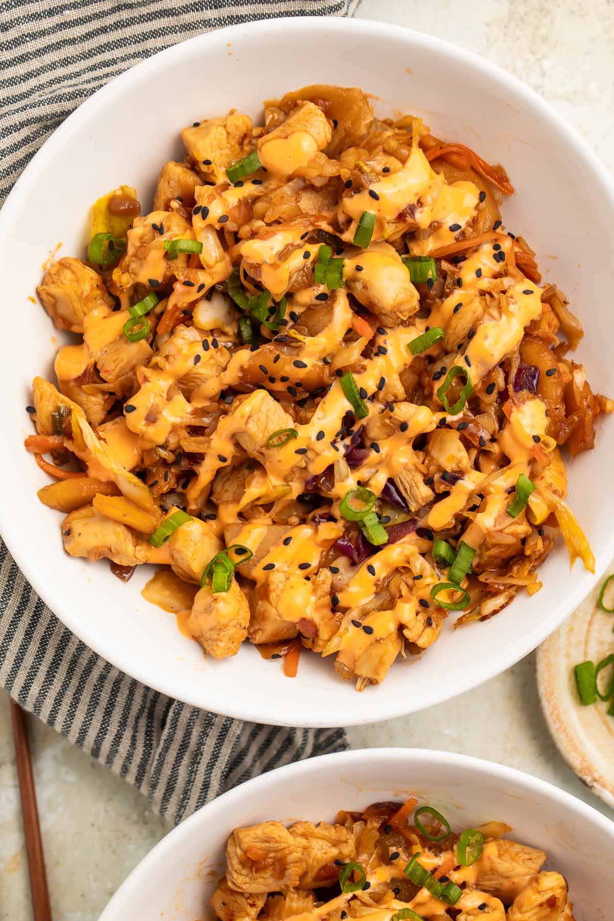 Close-up of chicken egg roll in a bowl on a table.