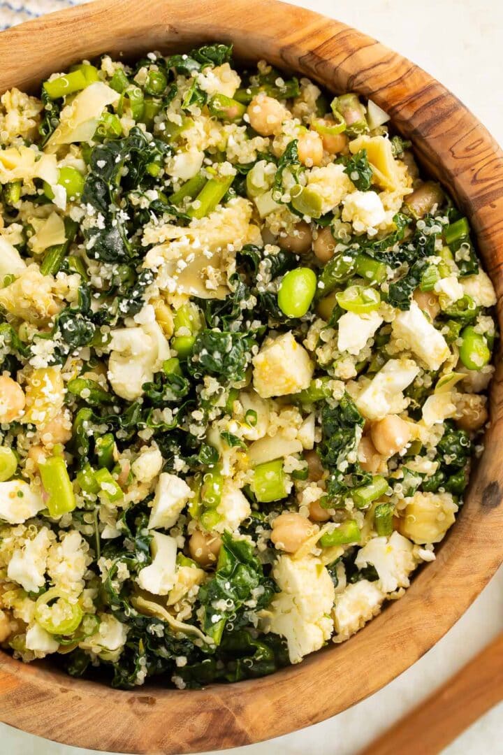 A close-up of a bowl of my favorite detox salad, loaded with chickpeas, quinoa, feta cheese, and more.