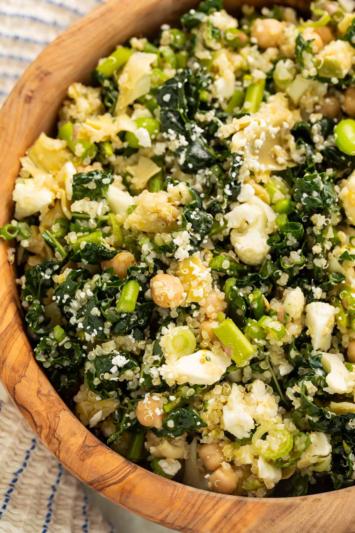 A close-up of a bowl of my favorite detox salad, loaded with chickpeas, quinoa, feta cheese, and more.