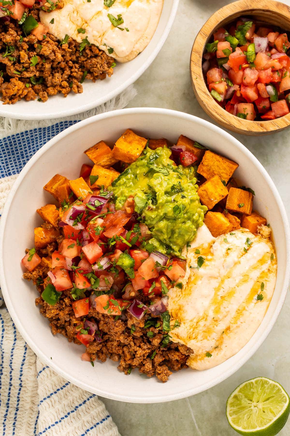 Overhead photo of a Southwest Ground Beef Bowl with Cottage Cheese Queso on a table.