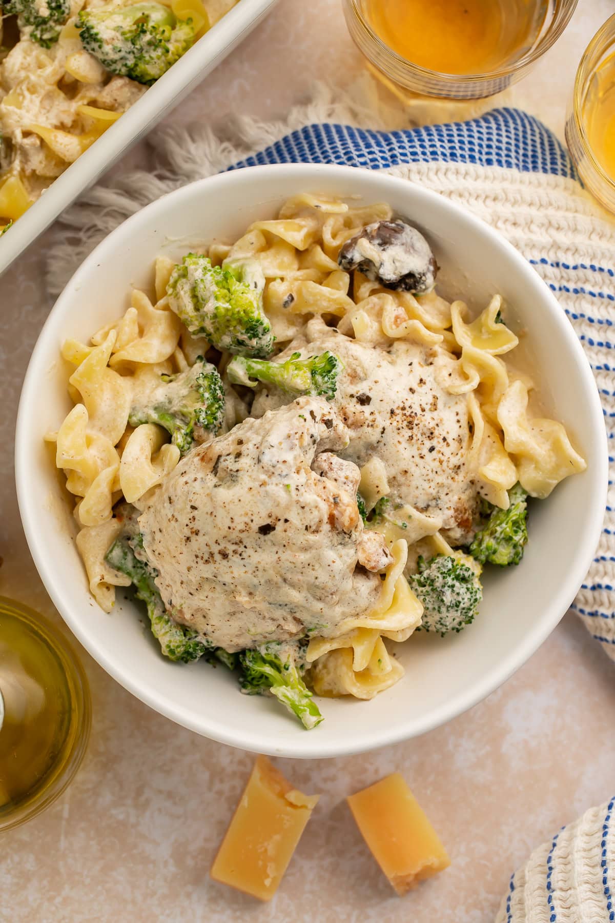Golden chicken divan with broccoli florets and egg noodles covered in creamy sour cream sauce