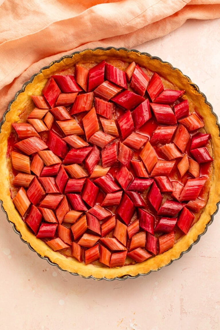 Homemade rhubarb tart with frangipane filling and glazed rhubarb topping