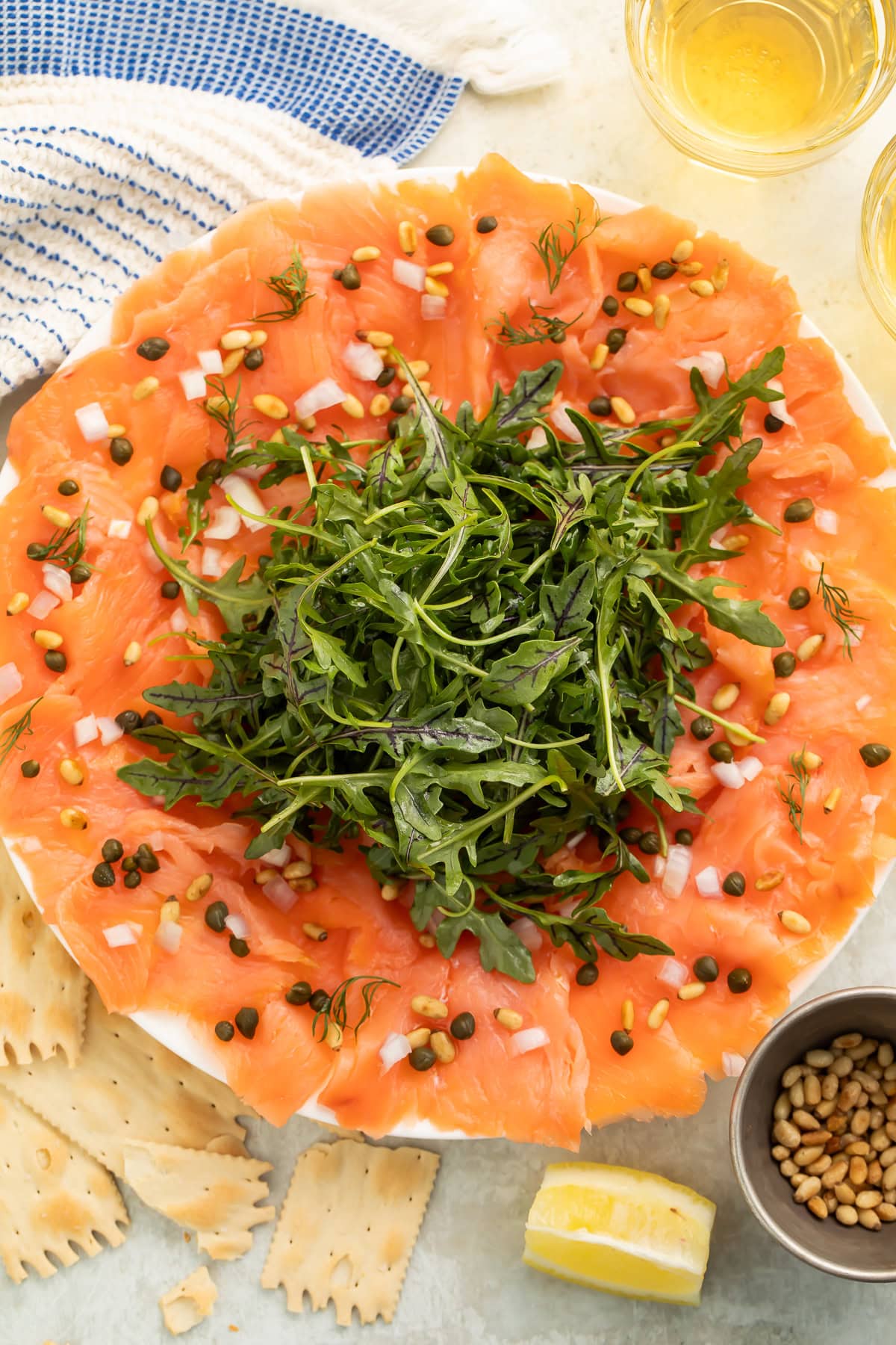 Brown butter ponzu salmon carpaccio with sliced jalapeños and glossy sauce 