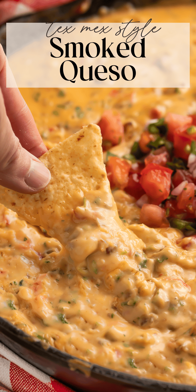 Creamy smoked queso dip with melted cheese and sausage in a cast iron skillet, garnished with fresh cilantro