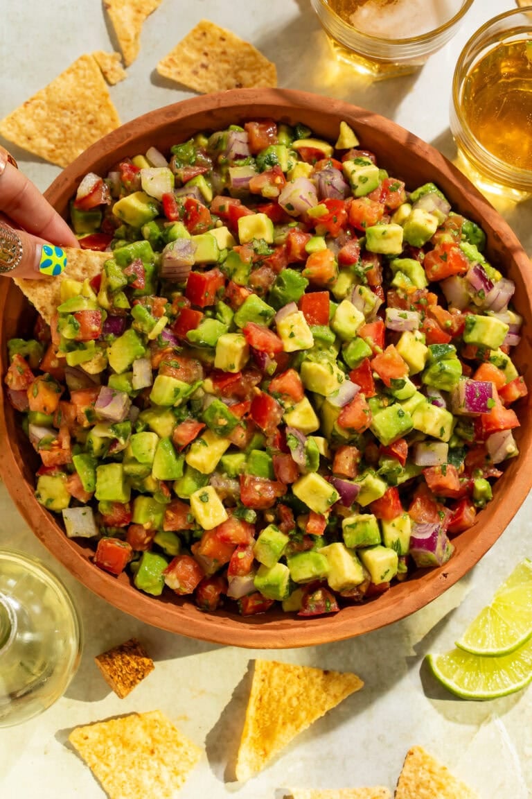 Close-up overhead view of fresh avocado tomato salsa showing colorful diced vegetables