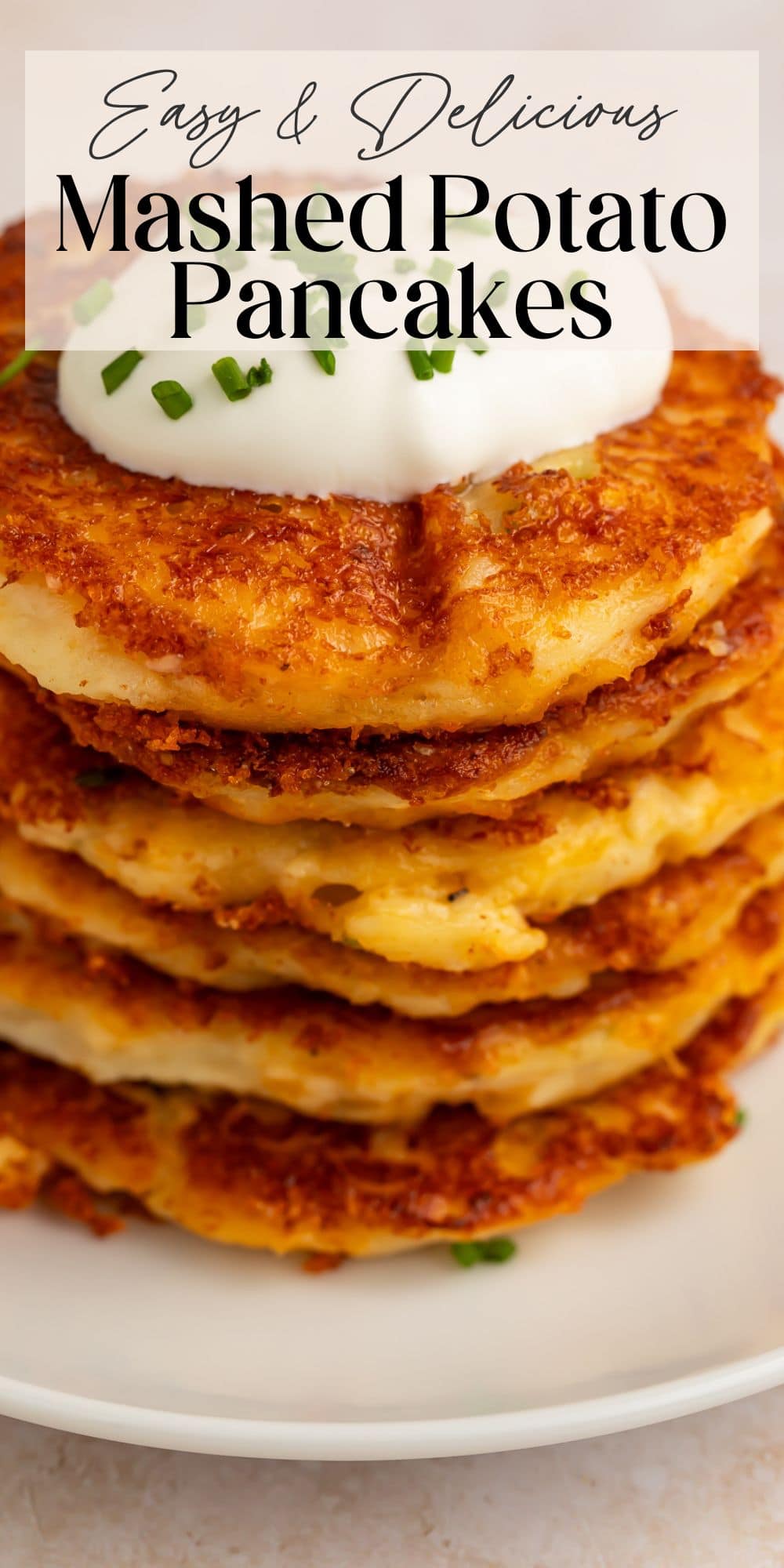 Stack of mashed potato pancakes with sour cream and text overlay Easy Delicious