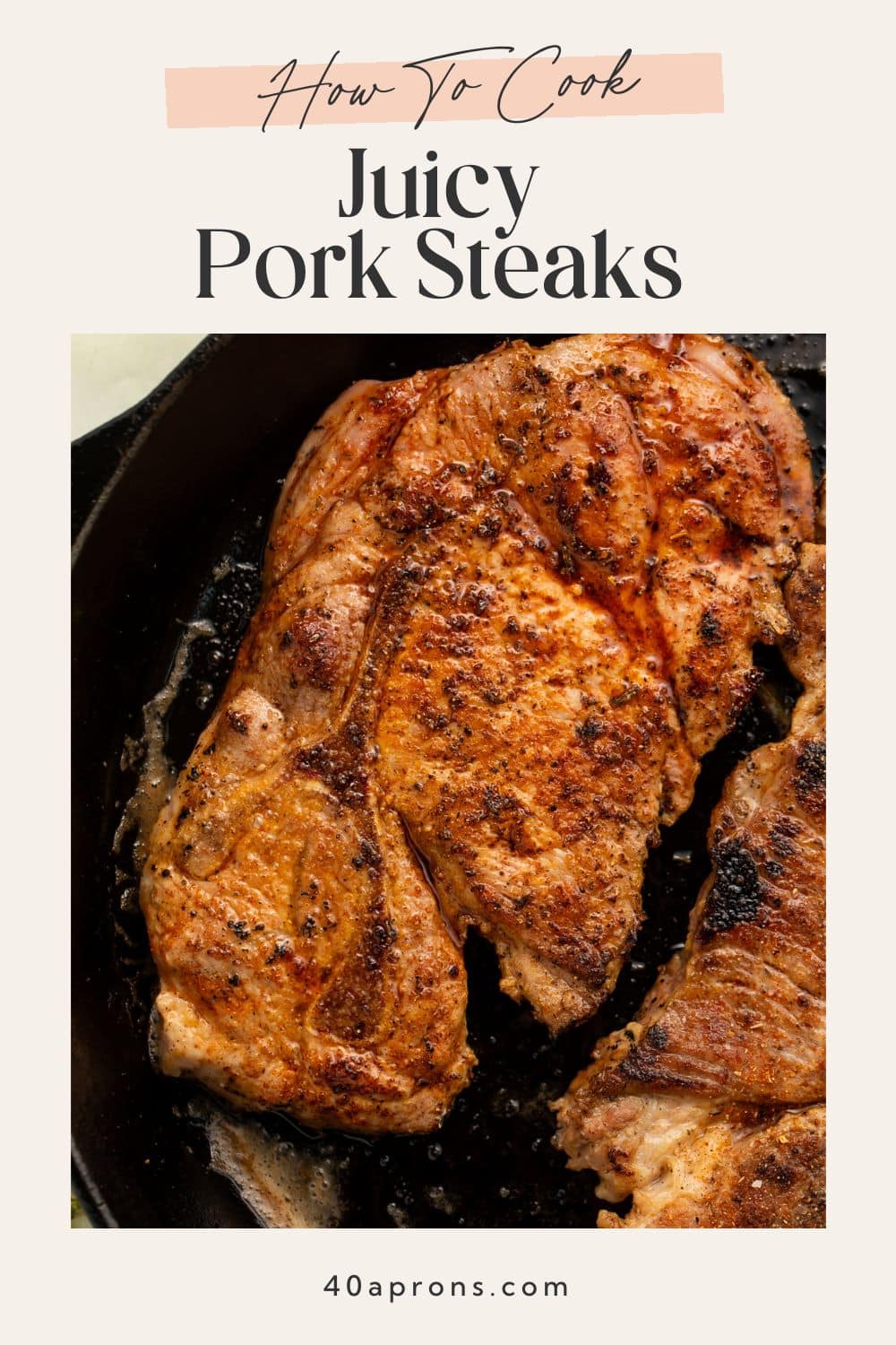 Thick juicy pork steaks with perfect golden sear in black cast iron cooking pan