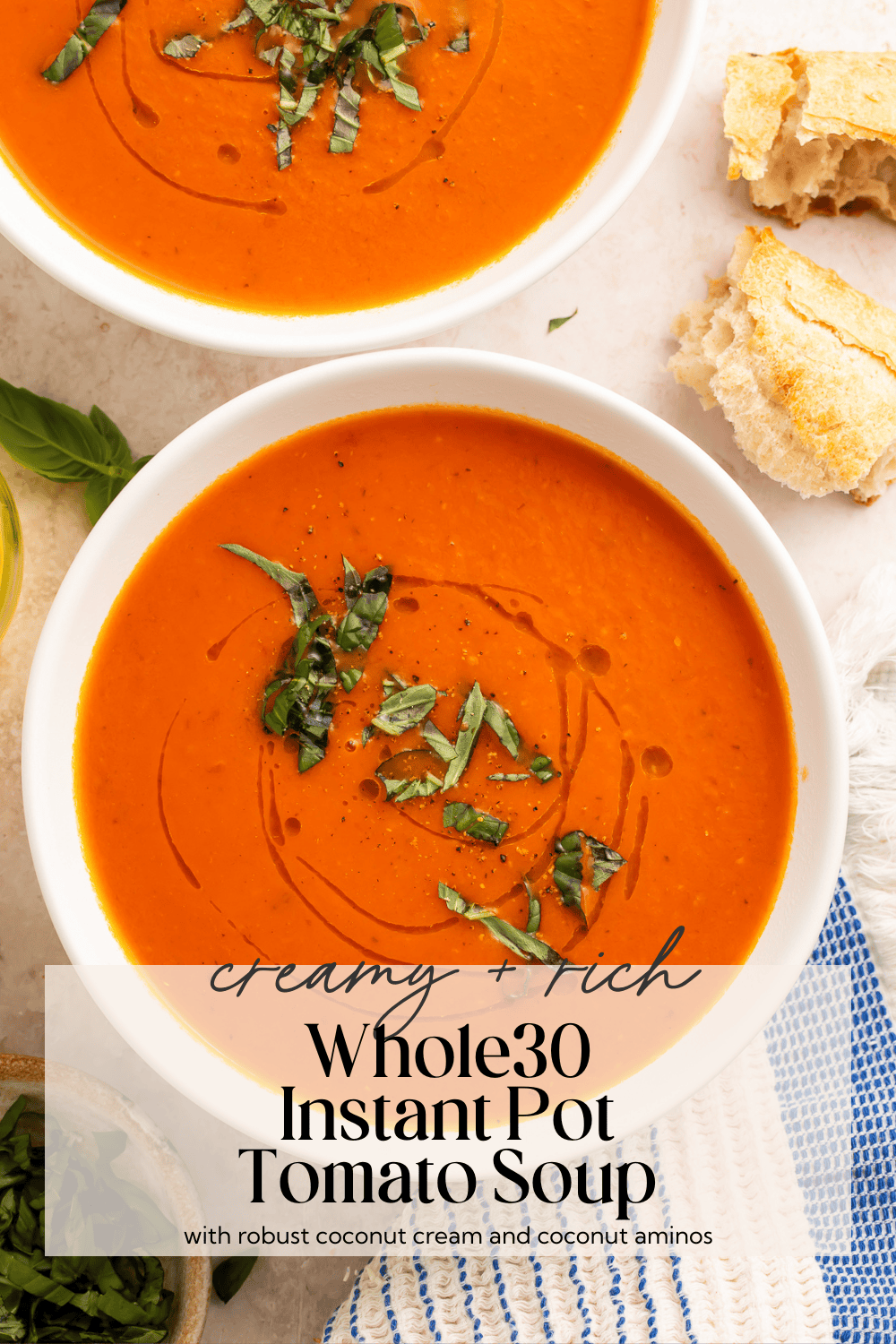 verhead view of multiple bowls of Whole30 tomato soup with crusty bread