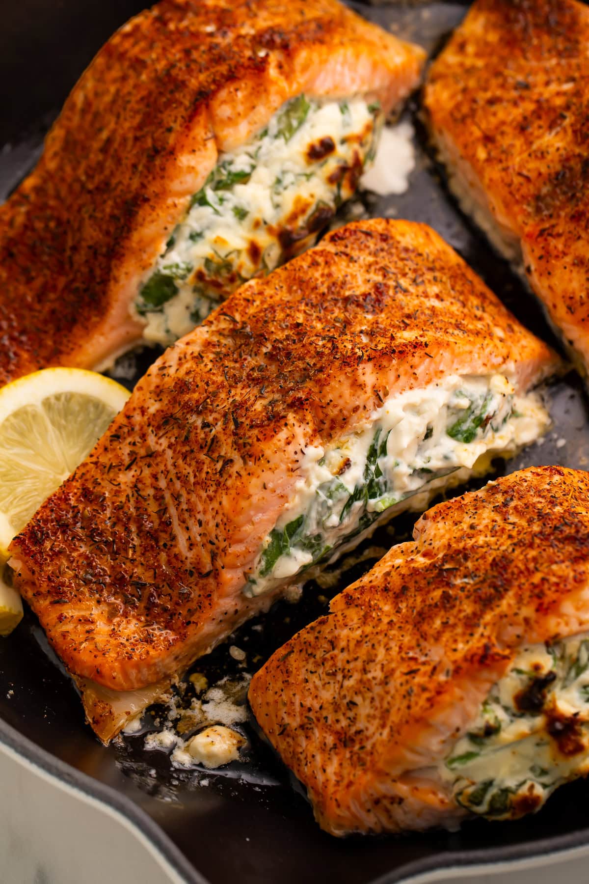 Close-up of stuffed salmon showing creamy spinach and cheese filling