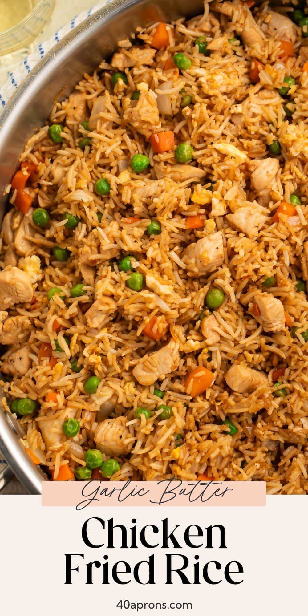 Overhead view of garlic butter chicken fried rice with pink recipe card overlay