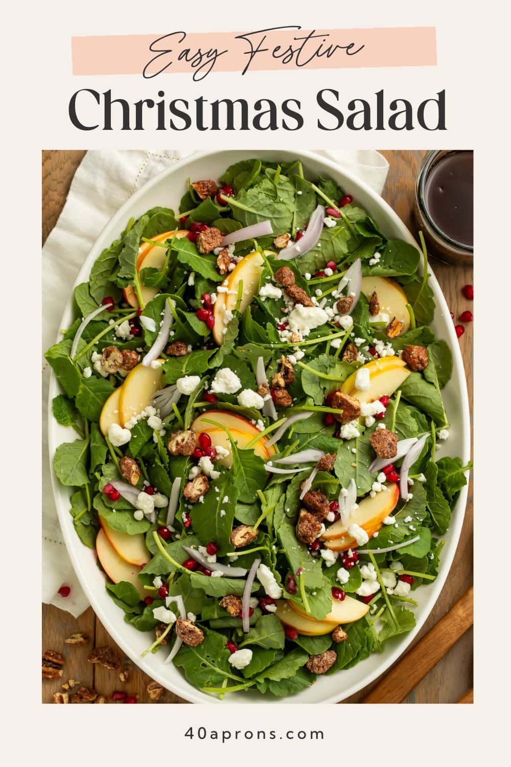 Pinterest pin for easy festive Christmas salad with arugula, apples, pomegranate, goat cheese and candied pecans.