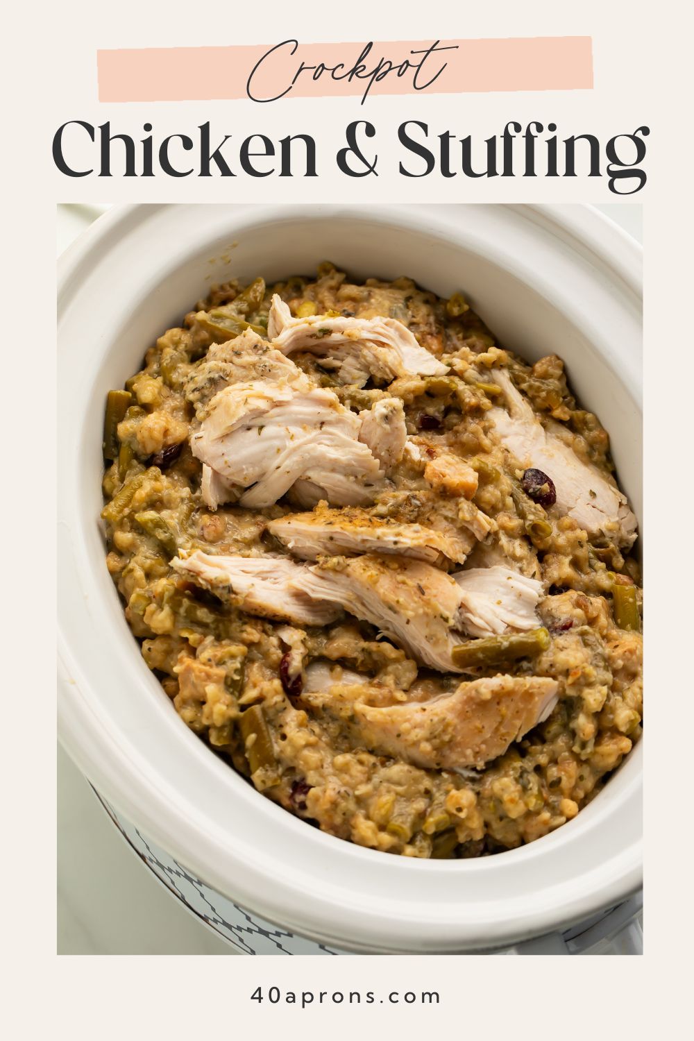 Sliced chicken breasts with herb stuffing in white crockpot insert with text overlay reading Crockpot Chicken and Stuffing