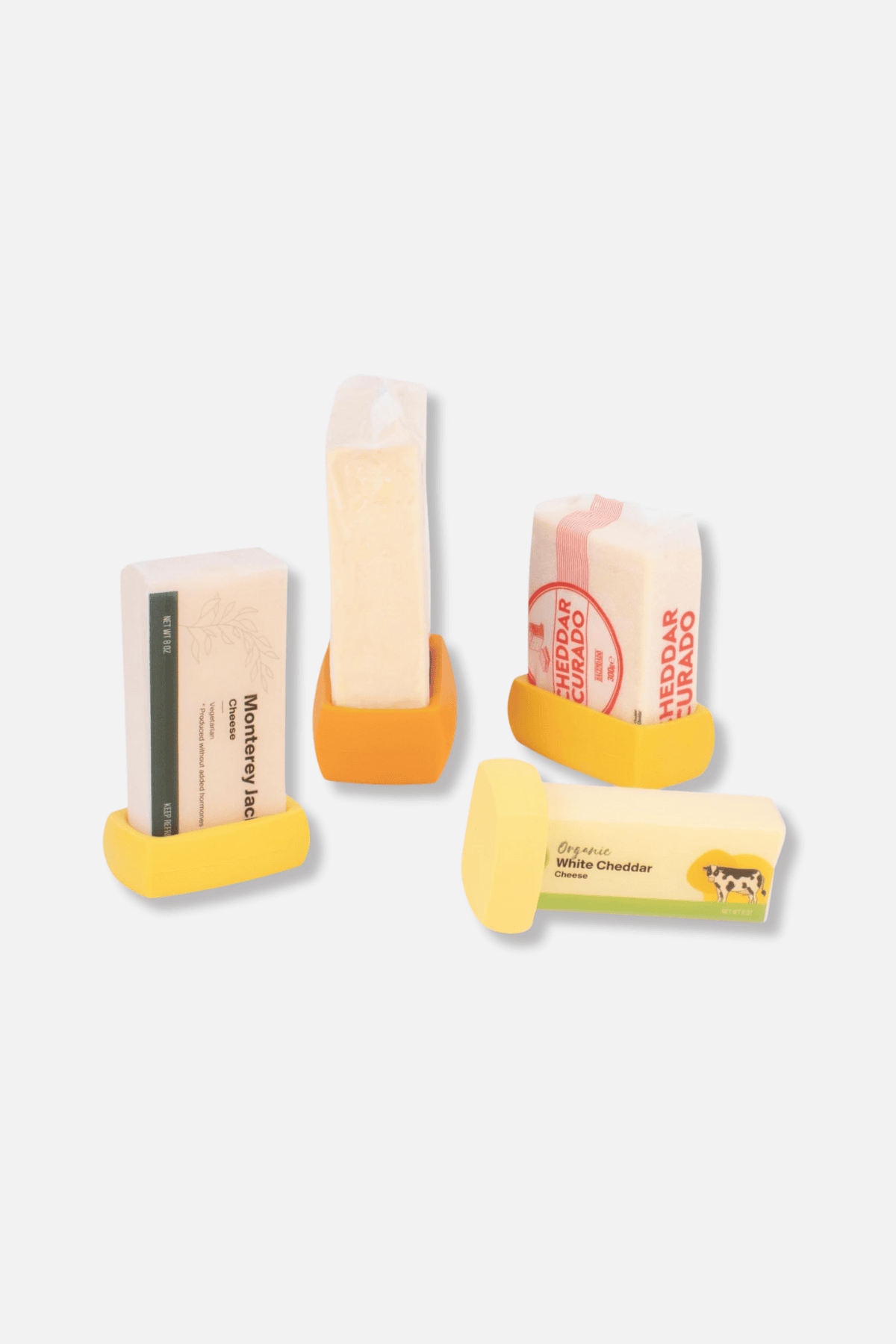 Food Huggers cheese savers in yellow silicone holding various cheese blocks