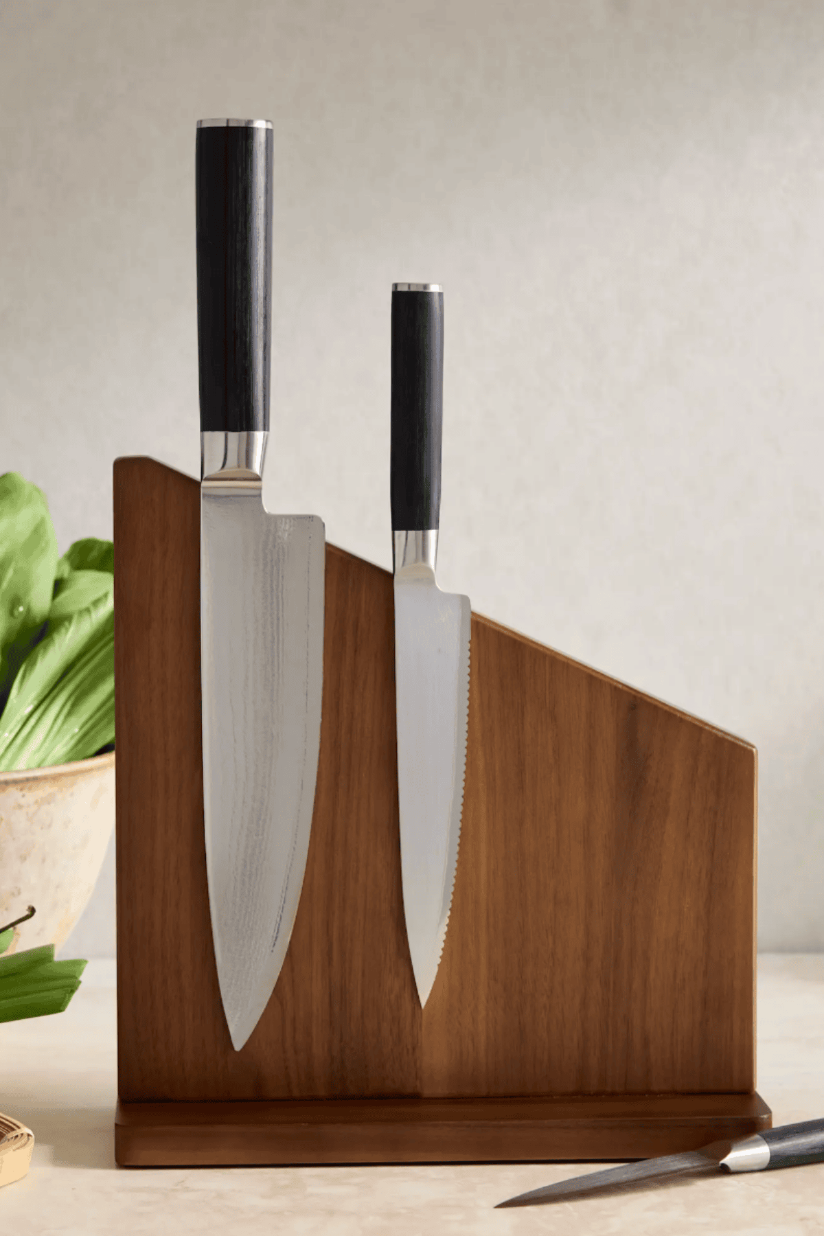 Quince walnut magnetic knife block holding chef knife and serrated knife