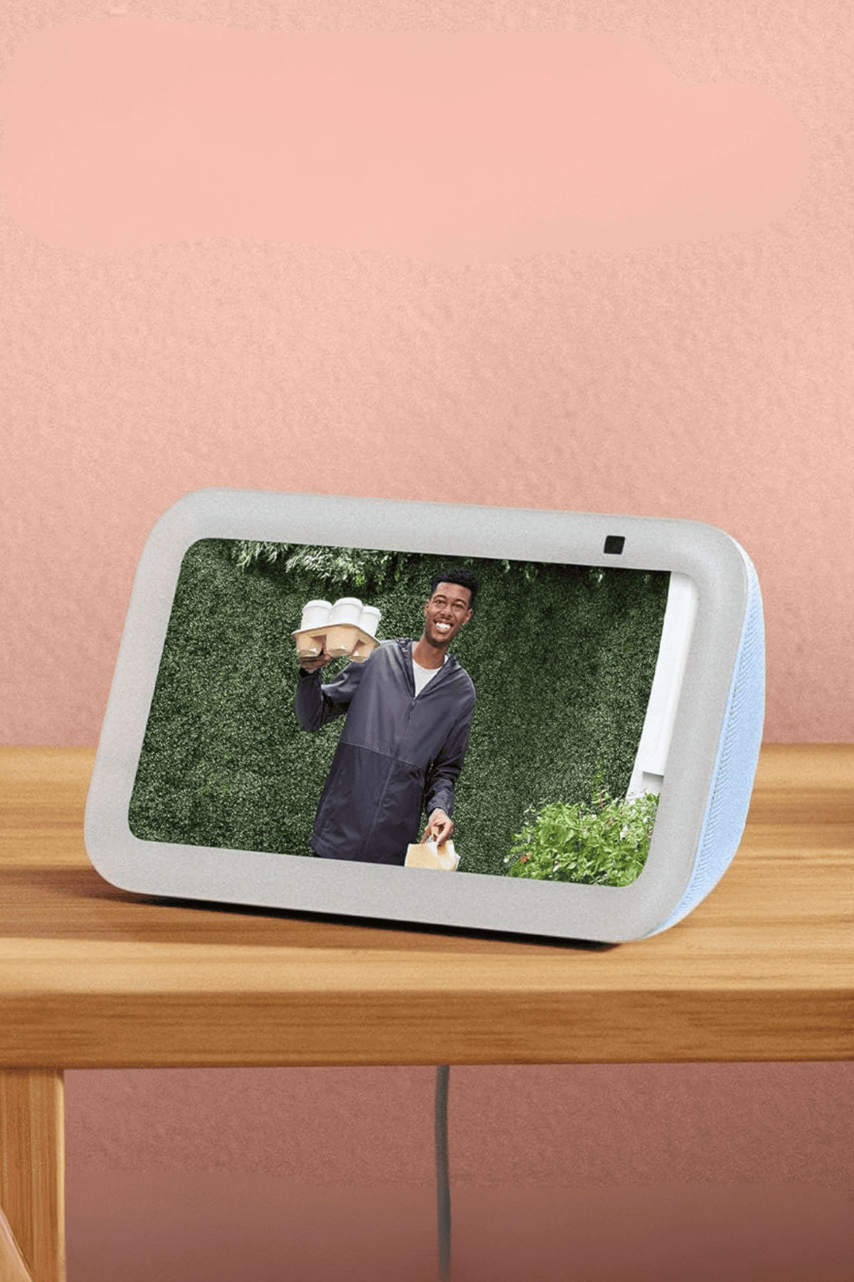 Amazon Echo Show 5 smart display in white showing video call on screen