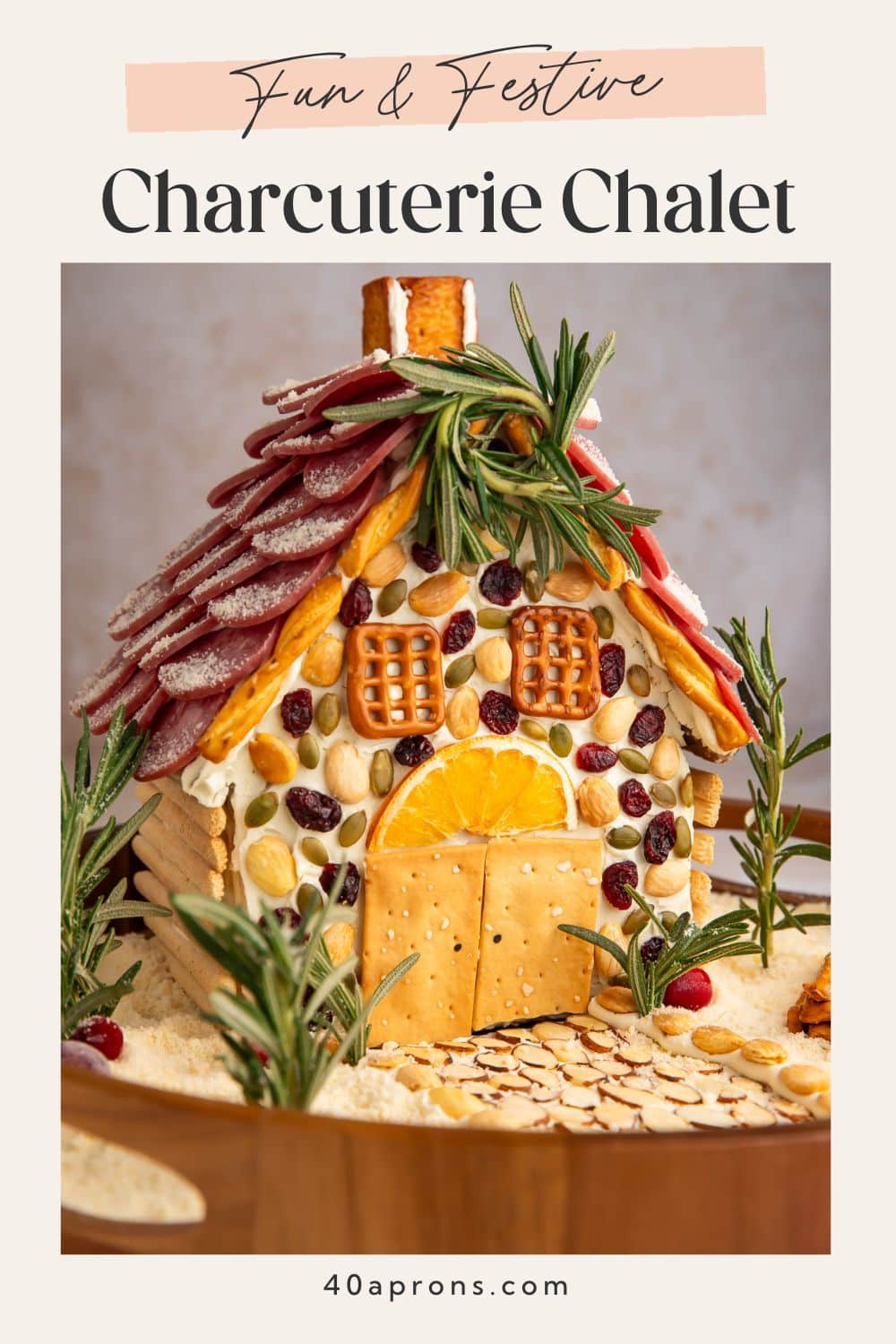 Charcuterie chalet Pinterest pin with fun and festive banner and holiday cheese board house photo.