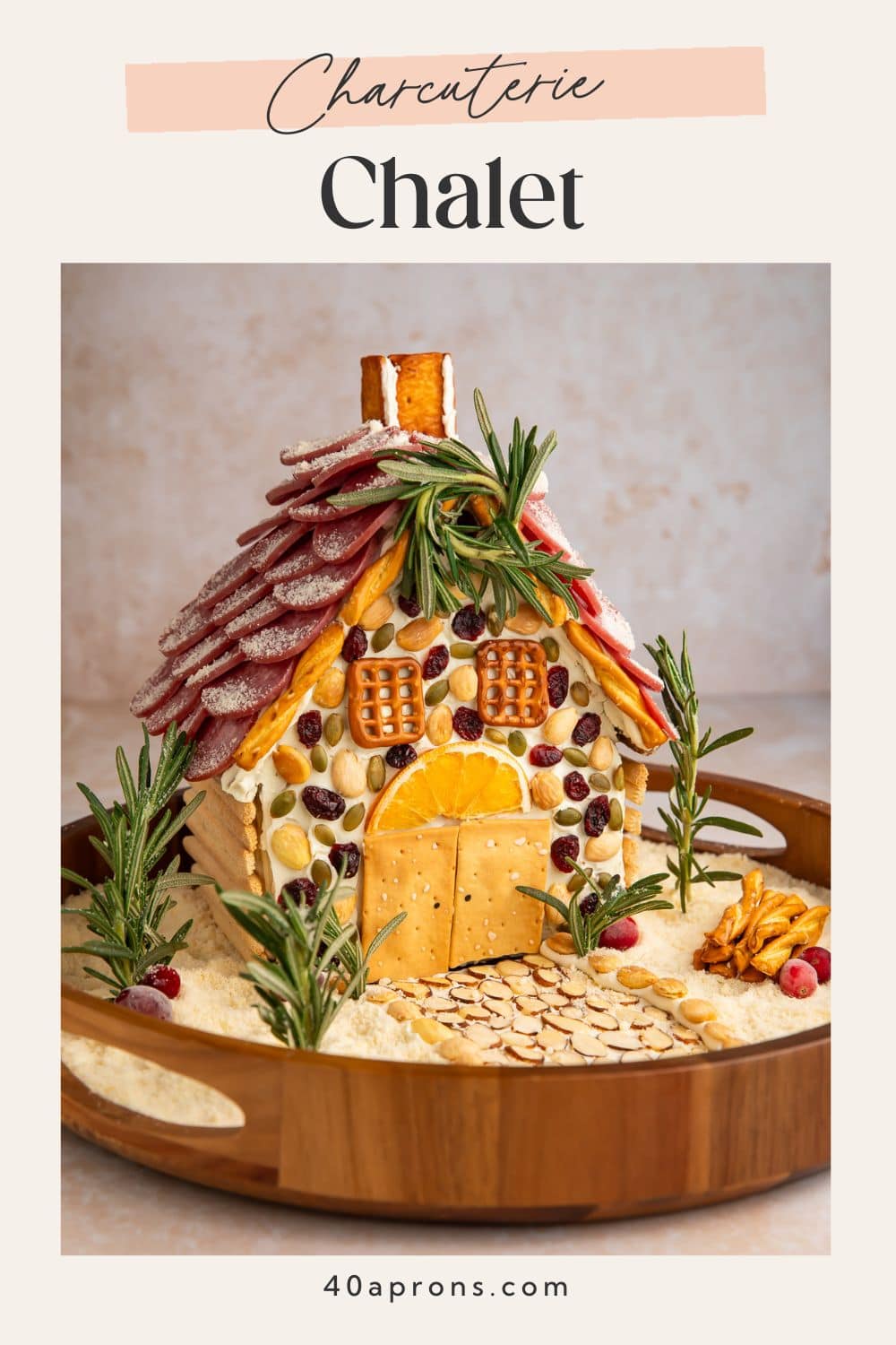 Charcuterie chalet Pinterest pin with minimalist design showing savory cheese board house.