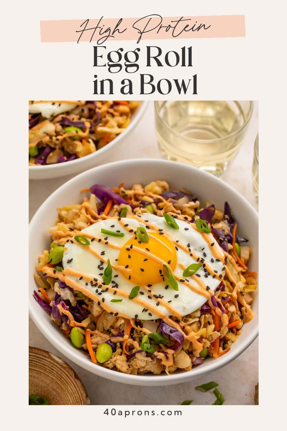 Pinterest pin for high protein egg roll in a bowl with fried egg and creamy chili sauce