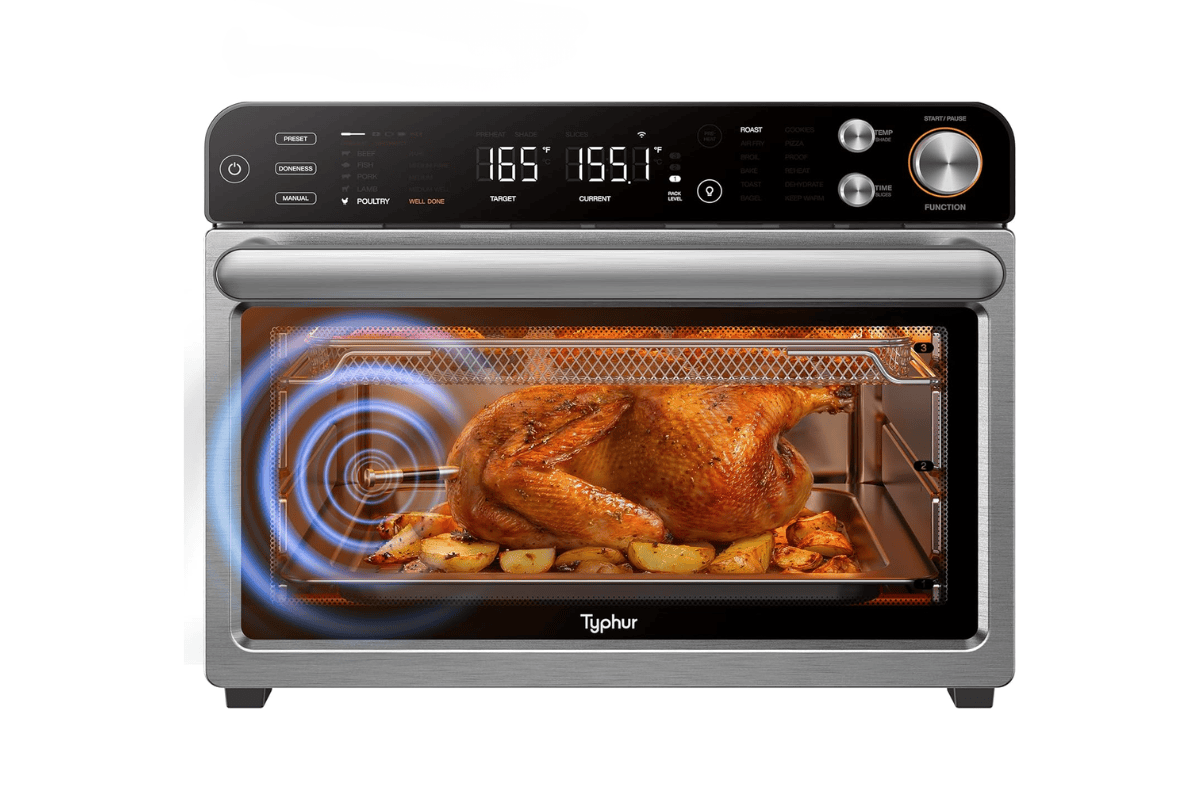 Typhur air fryer oven with whole roasted chicken and potatoes inside, digital display showing temperature