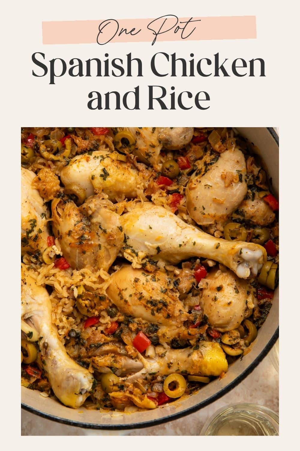 Pinterest pin showing an overhead Dutch oven filled with chicken drumsticks, herbed rice, green olives, and red pepper