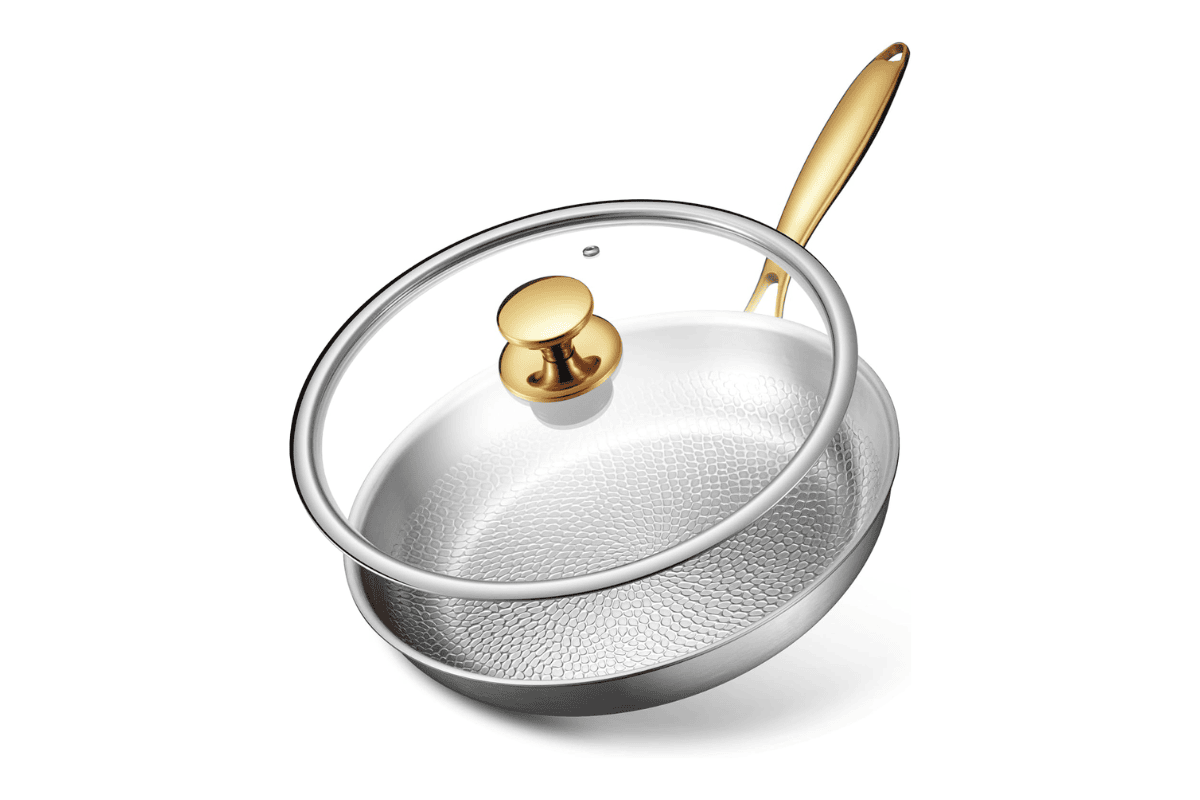 Titanium Wave hammered titanium skillet with glass lid and gold handle on white background