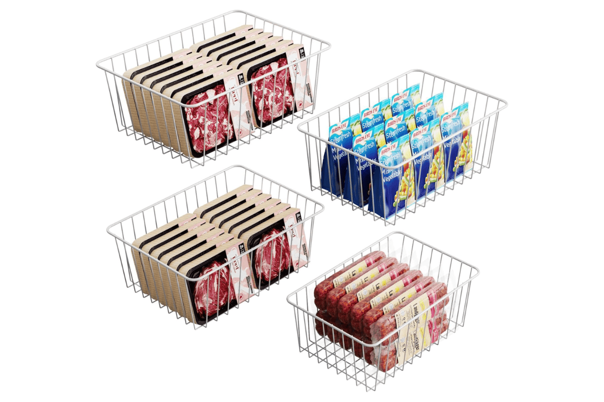 Wire freezer baskets filled with packaged meat, frozen vegetables, and sausage links.