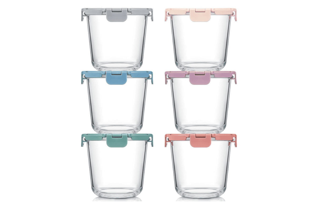 Set of six small glass food storage containers with pastel locking lids.