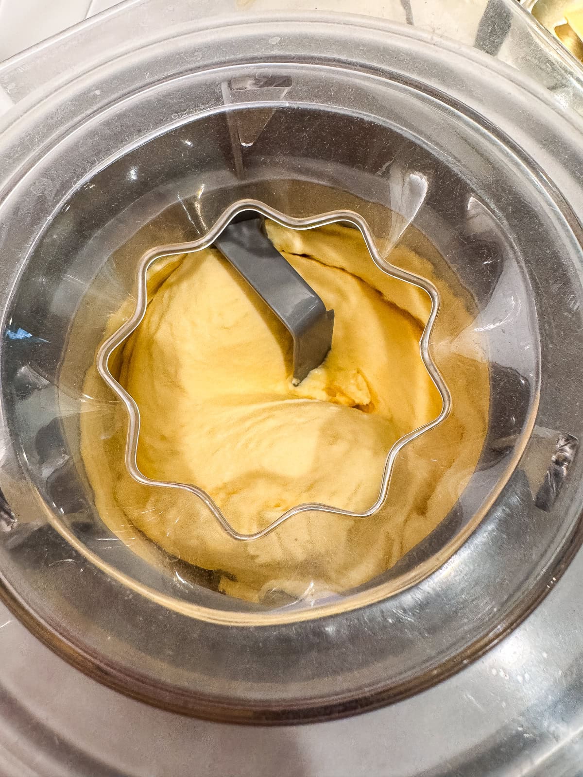 Fresh ice cream churning inside a Cuisinart ice cream maker