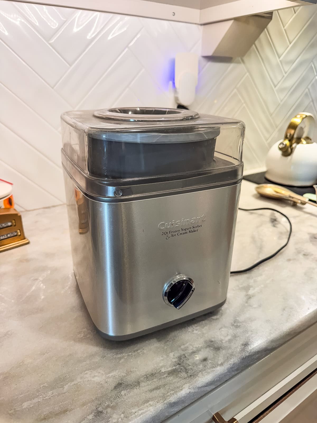 Cuisinart 2-quart ice cream maker with transparent lid on countertop