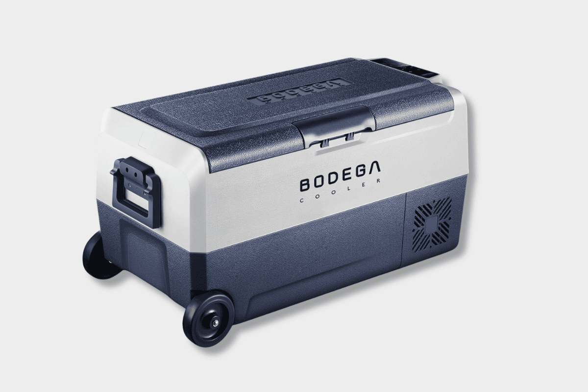 Bodega portable 12V car fridge freezer in navy and white with retractable handle and wheels
