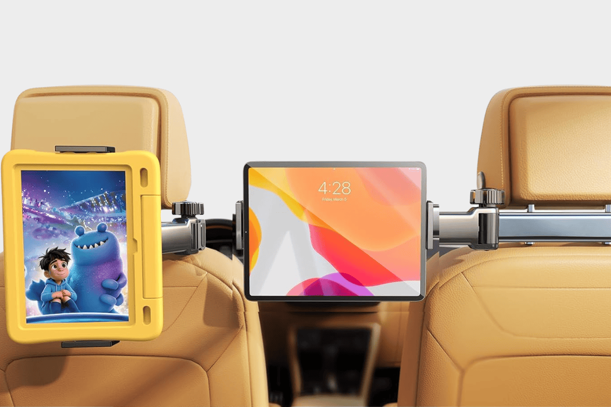 Dual car headrest tablet mount holding two tablets in tan leather vehicle backseat