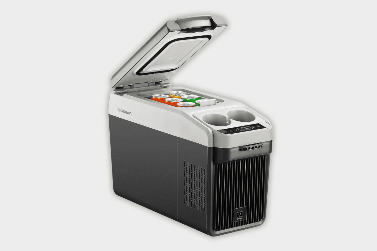 Tecnolove portable car cooler open lid showing canned beverages inside with built-in cup holders
