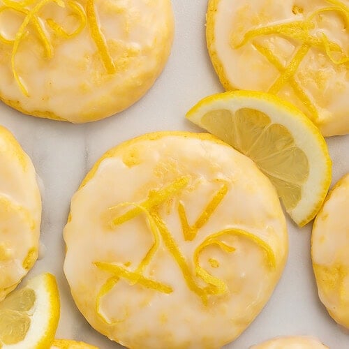 Close up of lemon cookies with lemon zest in the glaze.