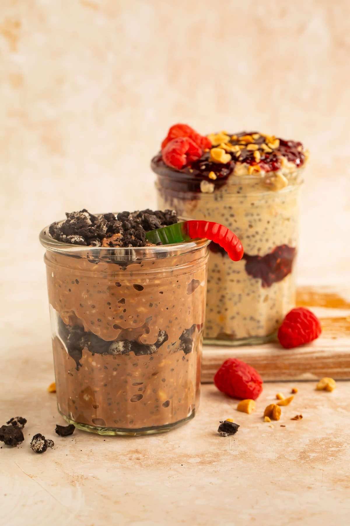 Chocolate yogurt parfait topped with crushed chocolate sandwich cookies and a gummy worm