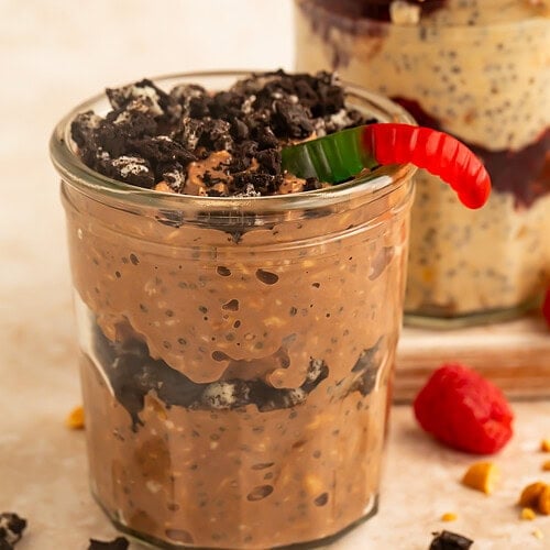 Close-up of a chocolate yogurt parfait layered with crushed chocolate sandwich cookies