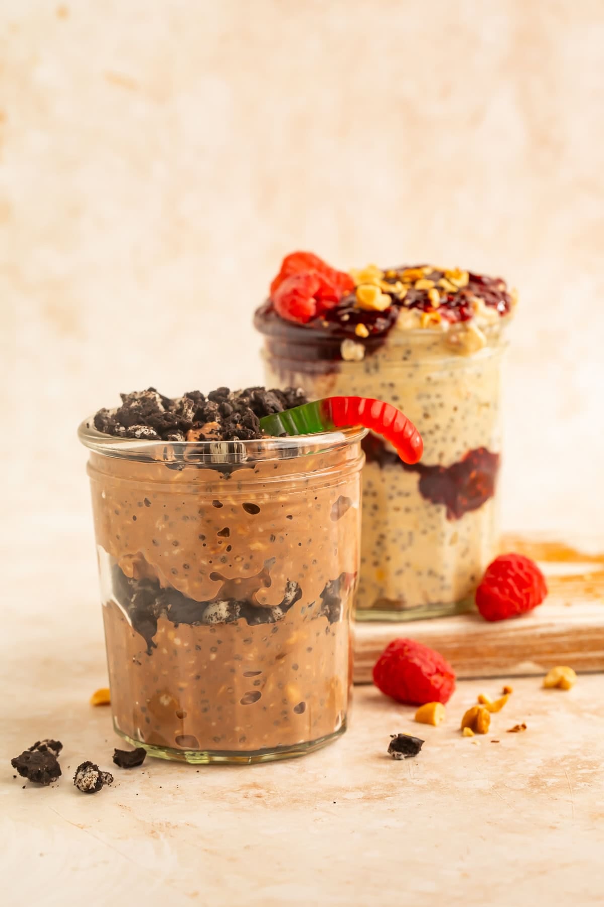 Berry yogurt parfait layered with raspberry preserves and topped with fresh raspberries and chopped peanuts.
