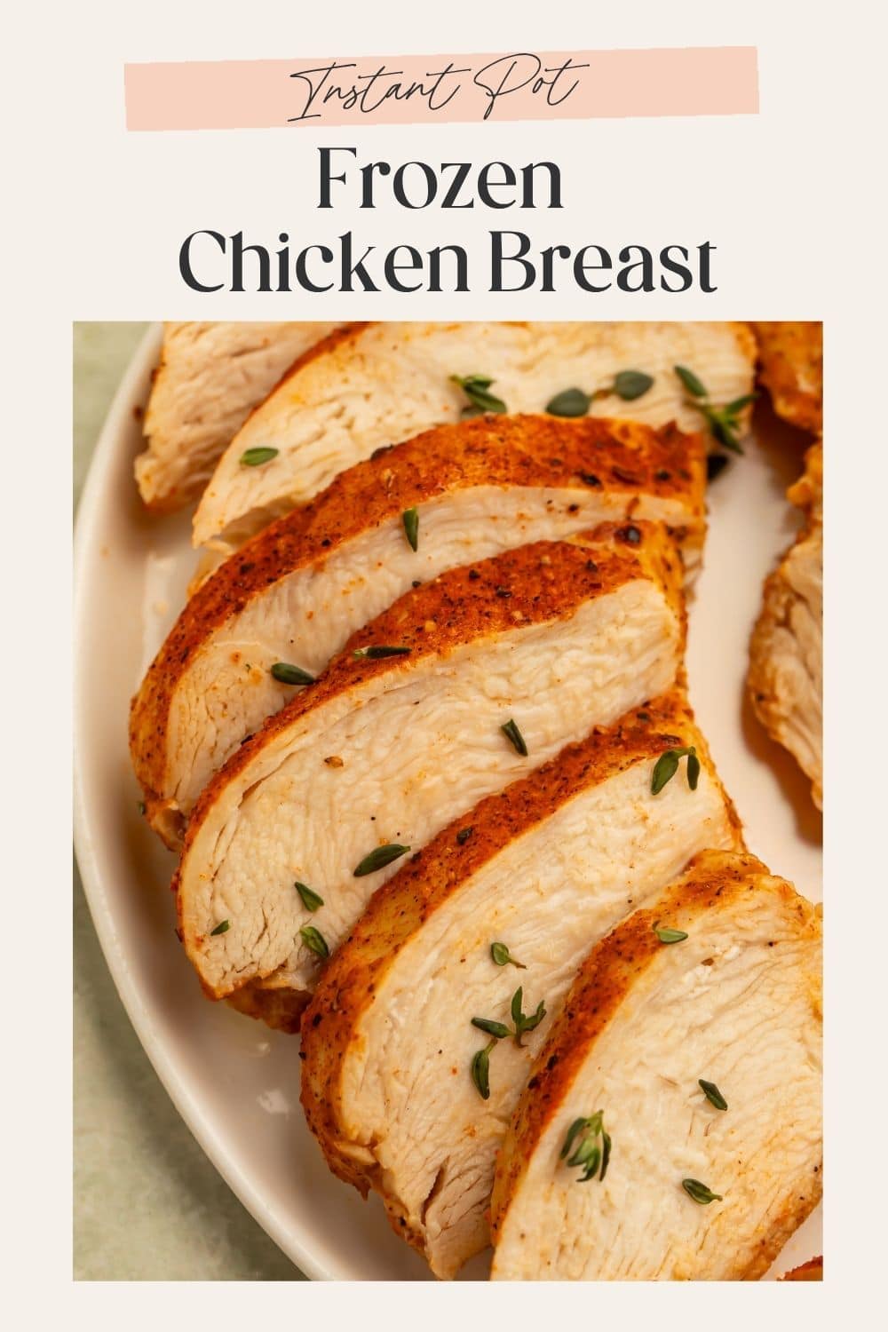 Close up sliced seasoned chicken breast sprinkled with fresh thyme. There is a frame on the image with Pinterest-optimized text.