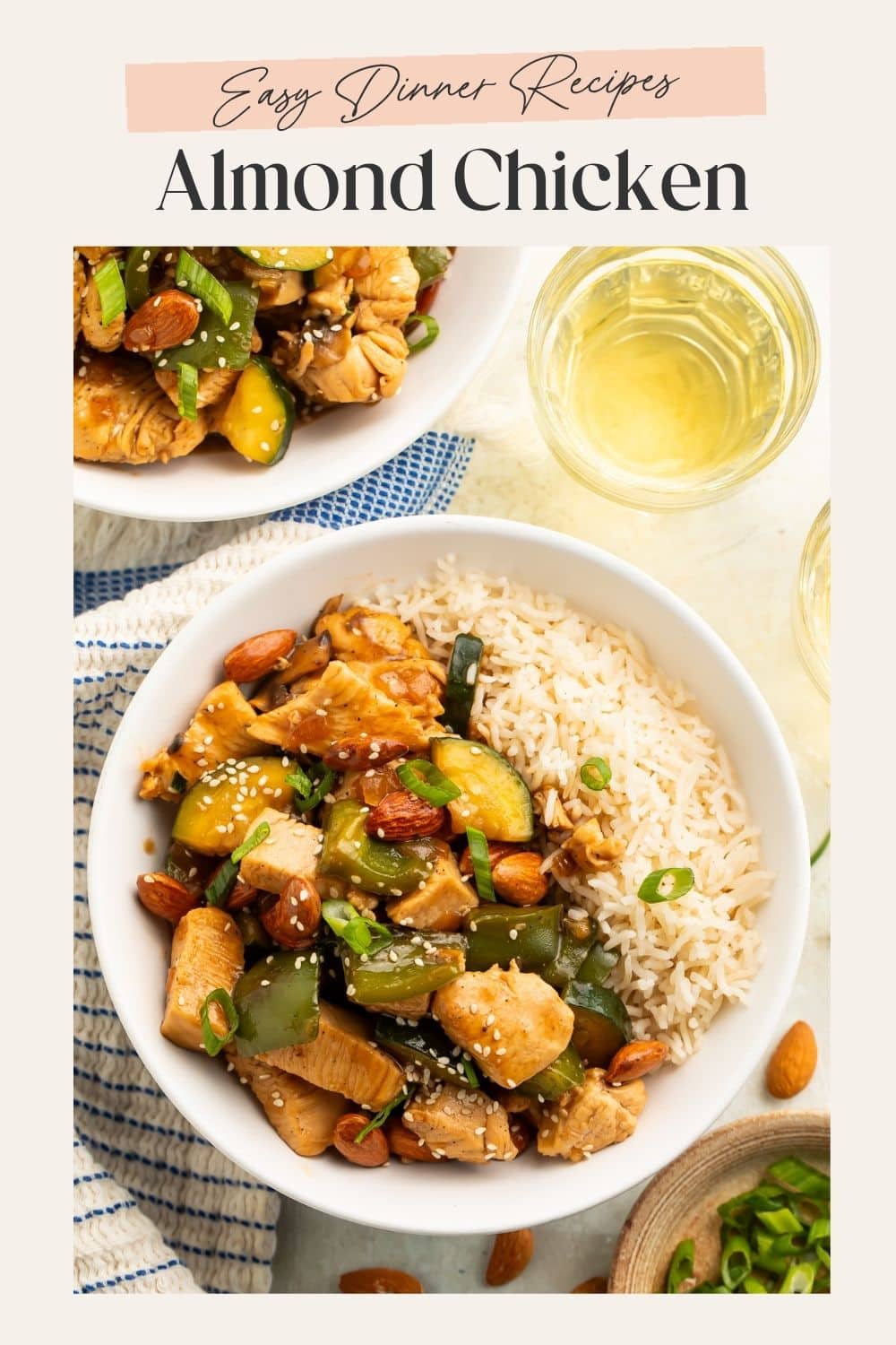 Two bowls of almond chicken stir fry with white rice. There is a frame on the image with Pinterest-friendly text.