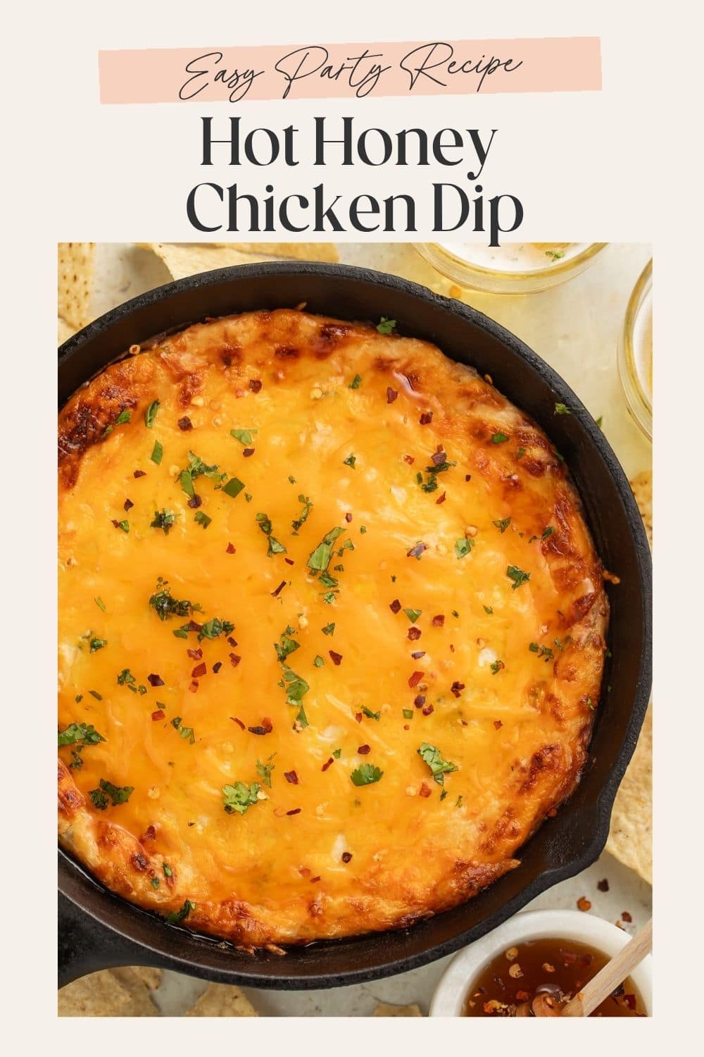 Overhead image of a cheesy dip in a cast iron skillet. There is a frame on the image with Pinterest-optimised text.