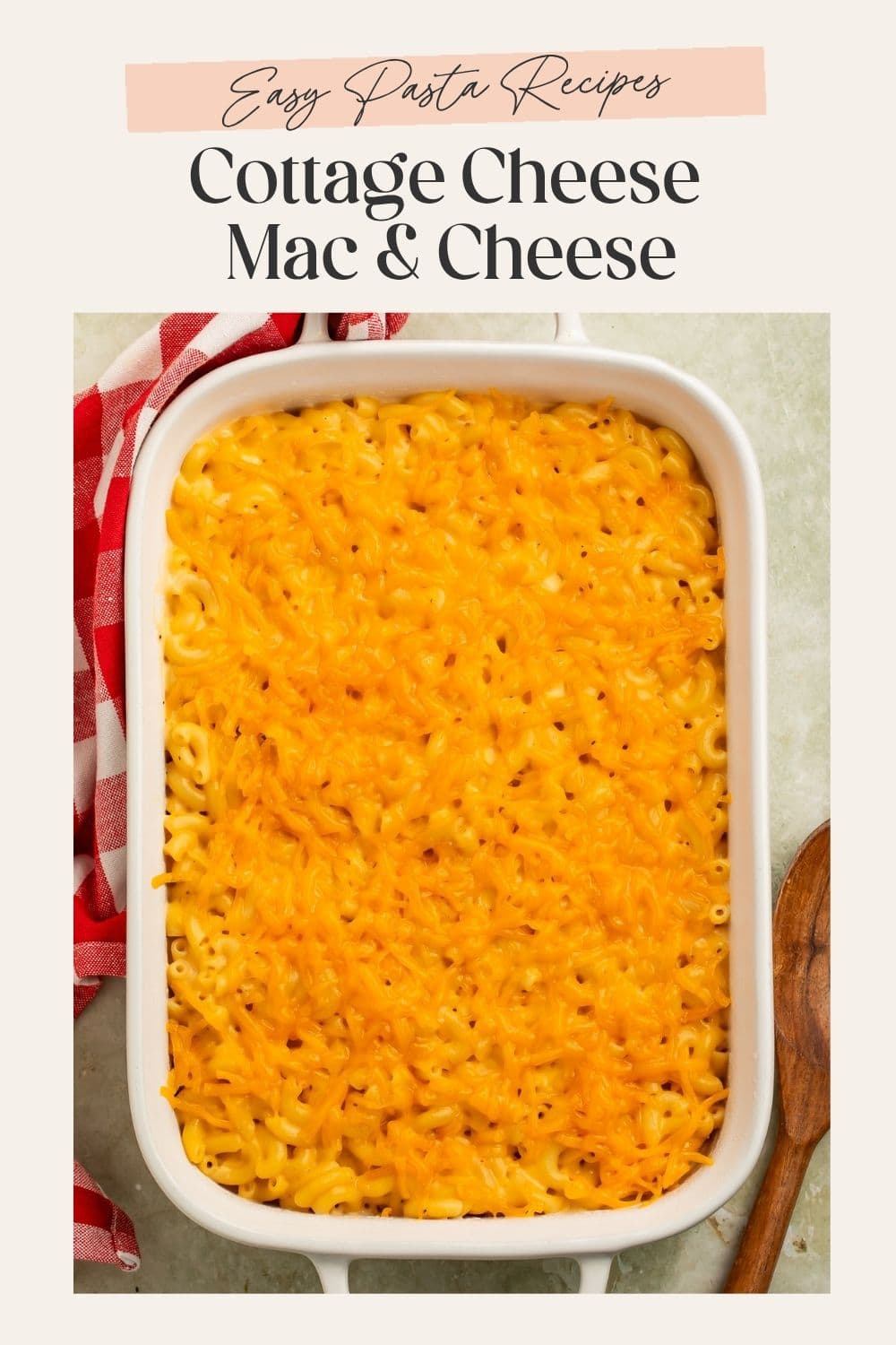 Overhead image of a baked dish of cottage cheese mac and cheese. There is a frame on the image with Pinterest-optimised text.