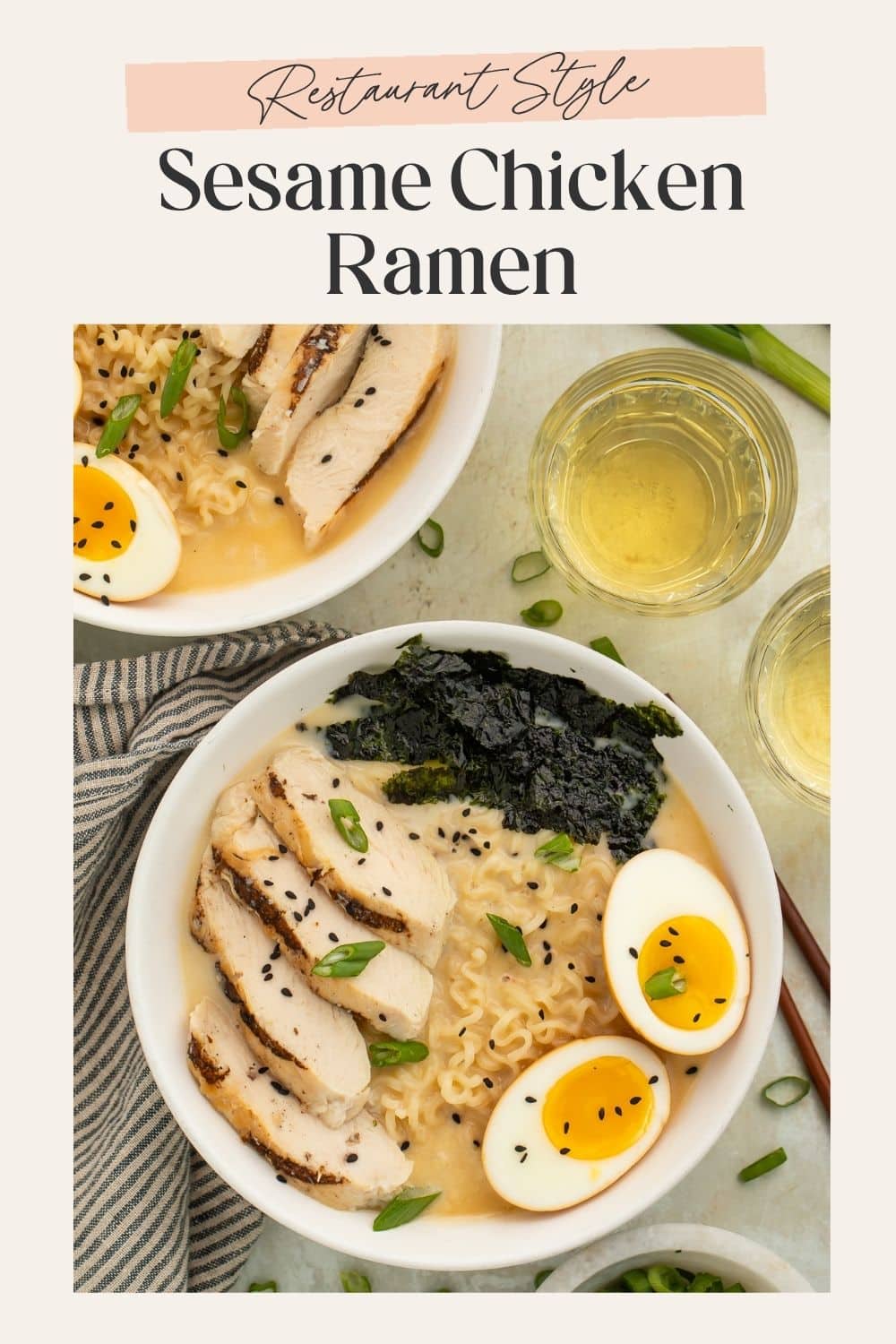 Overhead image of two bowls of creamy sesame ramen topped with sliced chicken, soft boiled eggs and torn nori sheets. There is a frame on the image with Pinterest-optimised text.